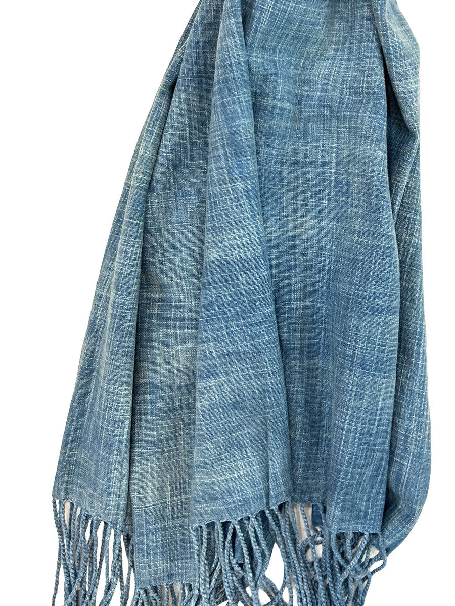 detail Handwoven Light Indigo Dyed Cotton Throw India. Handwoven indigo dyed cotton throw. This lush throw has a beautiful subtle pattern resulting from the way hand spun cotton threads were dyed in an 'abrash' method. Shades of light to medium indigo.