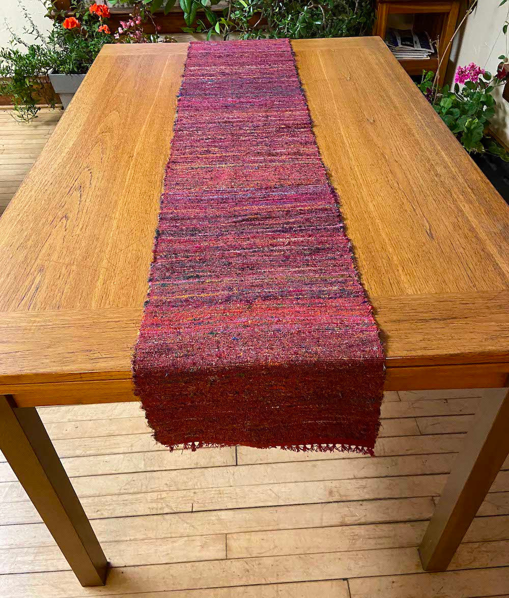 Handwoven of Recycled Silk and Cotton Table Runner Rose Nepal (12.5" x 70")  rose red and woven in fabrics are a mix of pink, orange, red, rose, greens, purple, blue and more