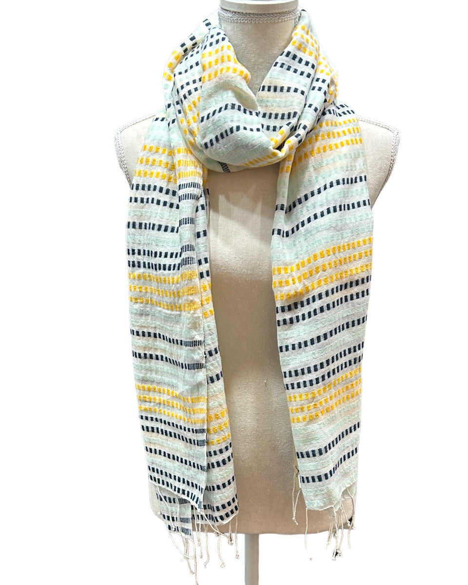 Beautiful handwoven  cotton scarf from the Gamo people in the southwester mountainous region of the country. This group trains women on pit looms who historically have been relegated to menial labor. This project is committed to zero waste utilizing all fragments of the process. Organically dyed, Hand wash. 