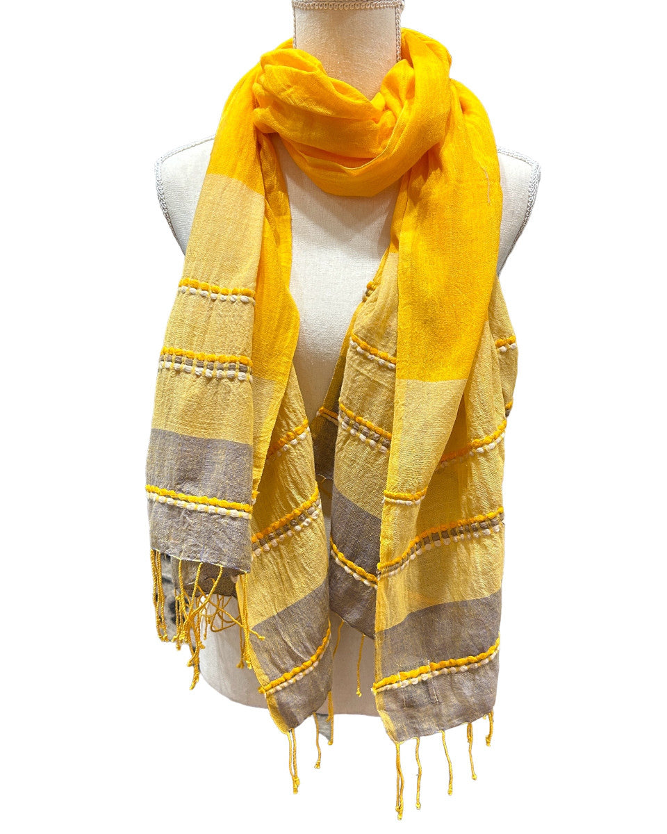 Beautiful handwoven  cotton scarf from the Gamo people in the southwester mountainous region of the country. This group trains women on pit looms who historically have been relegated to menial labor. This project is committed to zero waste utilizing all fragments of the process. Organically dyed, Hand wash. 